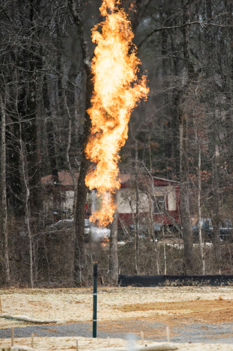 Excess gas is burned off from a natural gas well site.