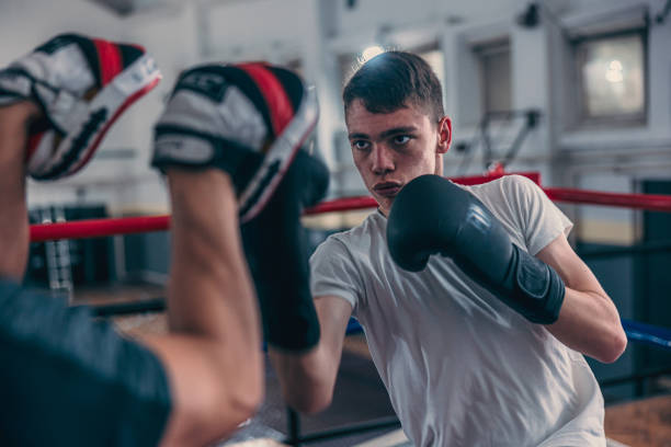 istock sparring and fighting on the boxing ring 1487361474