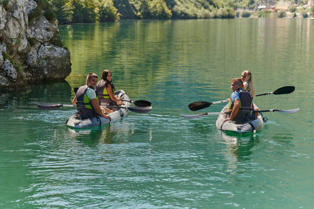istock A group of friends enjoying having fun and kayaking while exploring the calm river, surrounding forest and large natural river canyons 1487362094