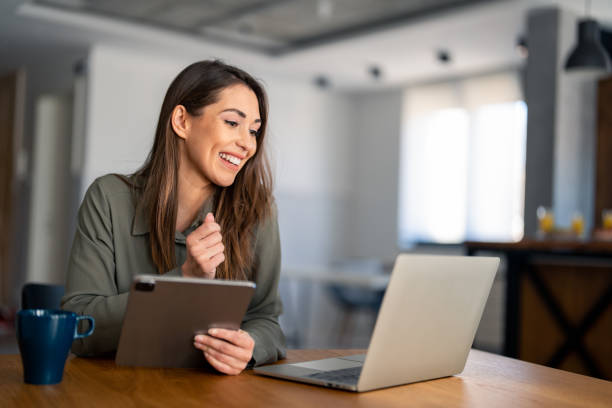istock Confident businesswoman executive coach in casual clothes using laptop computer 1487362905