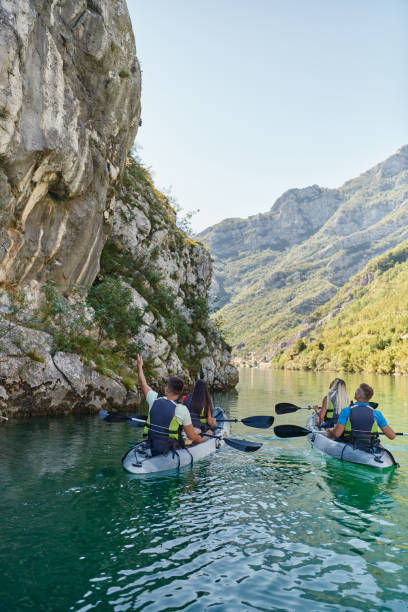 istock A group of friends enjoying having fun and kayaking while exploring the calm river, surrounding forest and large natural river canyons 1487364817