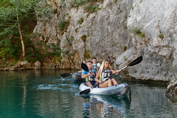istock A group of friends enjoying having fun and kayaking while exploring the calm river, surrounding forest and large natural river canyons 1487365054