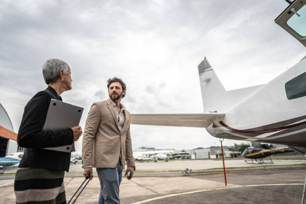 istock Passengers talking while walk in the airport hangar 1487367328