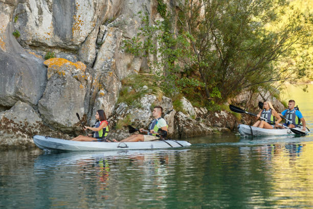 istock A group of friends enjoying having fun and kayaking while exploring the calm river, surrounding forest and large natural river canyons 1487368432