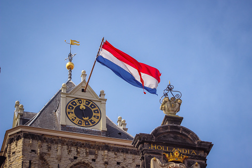 Delft, the Netherlands - April, 2023: King’s day (Koningsdag - Koninginnedag) 2023, the national holiday where the Dutch celebrate the kings birthday on April 27th. Traditionally people will raise the flag.