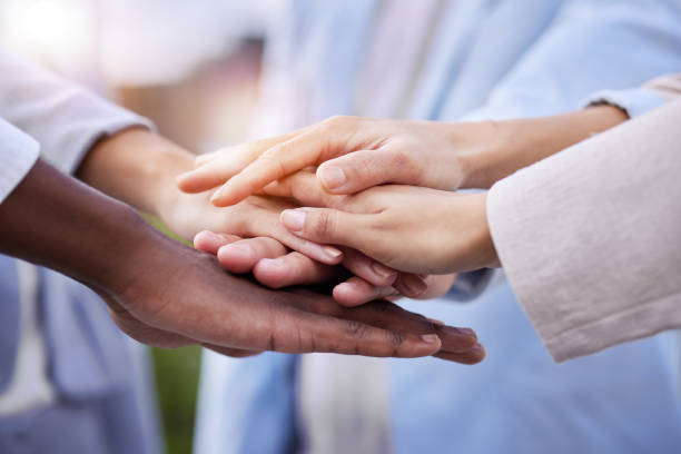 istock Team, doctors and stack hands for motivation, support and collaboration with trust, solidarity and diversity. Close up, hand together and doctor with teamwork, goals and help in healthcare at clinic 1487370300