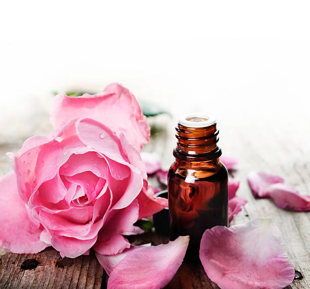 istock Essential oil with roses on a wooden table 148737067