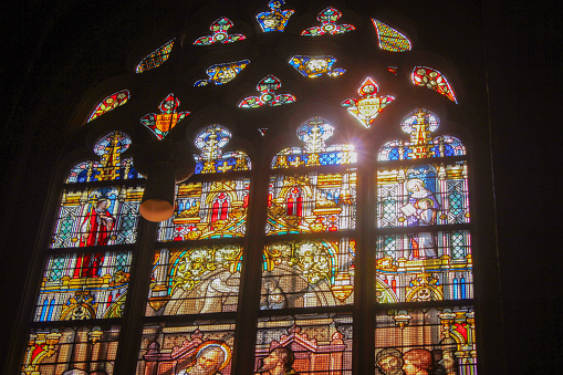 Lier, Belgium - May 16, 2016: LIER, BELGIUM - MAY 16, 2015: Stained Glass window in St Gummarus Church in Lier, Belgium, depicting the Orthodox Church Fathers Saints Gregory of Nazianzus, Athanasius of Alexandria, John Chrysostomus and Basil