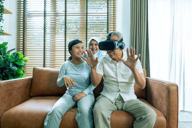 istock Multi generation family playing VR game in home 1487373799