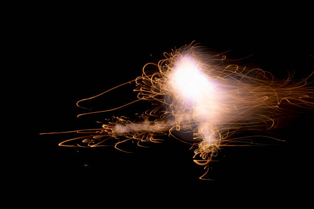 istock fire in dark. luminous lines of sparks. explosion black powder. 1487374097