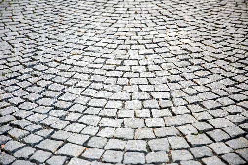 Closeup Cobblestone pavement, background with copy space, full frame horizontal composition