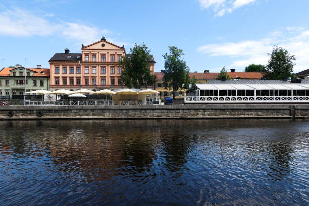 istock View of buildings by river against sky 1487381134