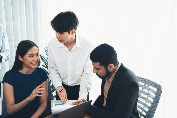 istock Asian office workers in office discussing and working together. Concord 1487386121