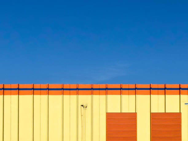 istock Yellow warehouse against a blue sky 1487386304