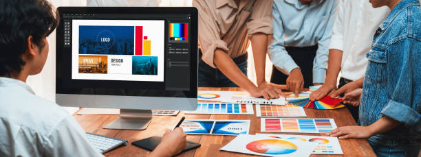 istock Graphic designer works on computer laptop with digital pen. Scrutinize 1487386439
