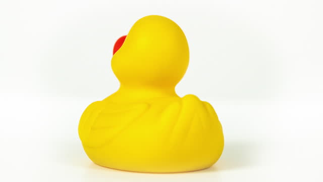 Rubber duck rotating against white background