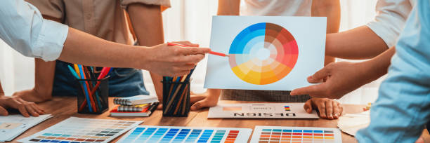 istock Graphic designer brainstorming logo and graphic arts at workshop. Scrutinize 1487386568