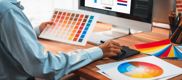 istock Graphic designer works on computer laptop with digital pen. Scrutinize 1487387186