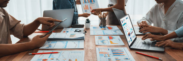 istock Analyst team utilizing BI Fintech to analyze financial report. Scrutinize 1487389000