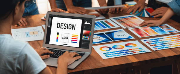 istock Graphic designer brainstorming logo and graphic arts at workshop. Scrutinize 1487389059