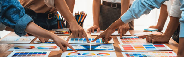istock Graphic designer brainstorming logo and graphic arts at workshop. Scrutinize 1487389077