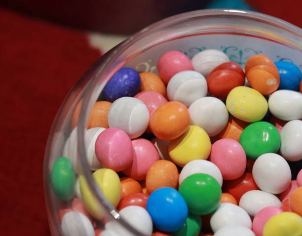 istock Candy of various colors in a glass jar 1487389080