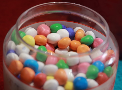 Colorful pieces of candy in a glass bowl