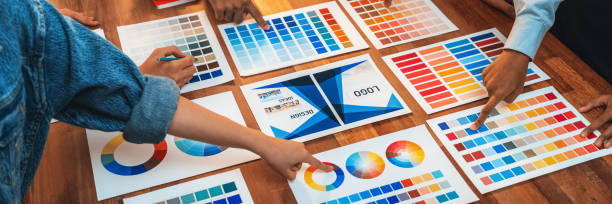 istock Graphic designer brainstorming logo and graphic arts at workshop. Scrutinize 1487389148