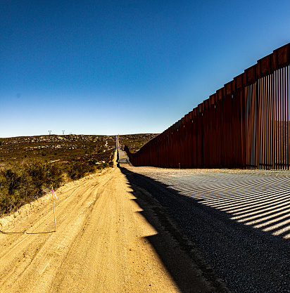 Campo, CA, USA - November 13, 2021: Views of the US border wall located near San Diego, California.
