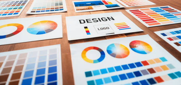 istock Various color palette idea papers arranged on workspace for designer. Scrutinize 1487389256