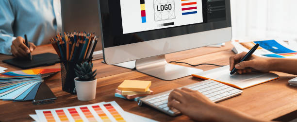 istock Graphic designer works on computer laptop with digital pen. Scrutinize 1487389286