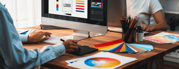 istock Graphic designer works on computer laptop with digital pen. Scrutinize 1487389326