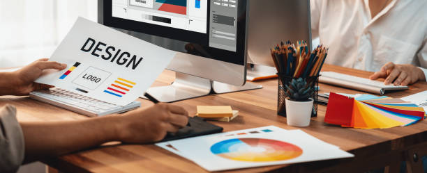 istock Graphic designer works on computer laptop with digital pen. Scrutinize 1487389408