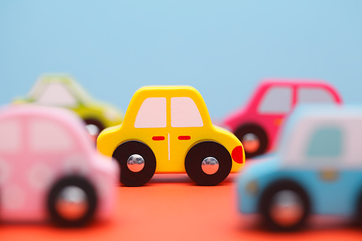 Little colorful wooden toy cars