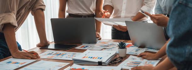 istock Analyst team utilizing BI Fintech to analyze financial dashboard. Scrutinize 1487390595