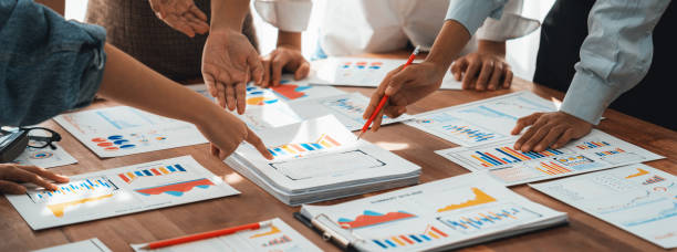 istock Analyst team utilizing BI Fintech to analyze financial dashboard. Scrutinize 1487391200