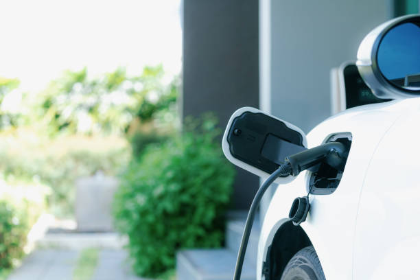 istock EV car plugged-in with cable from progressive home charging station. 1487396116