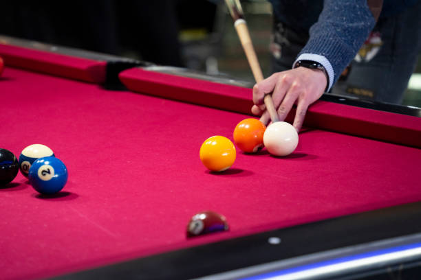 istock Playing billiards at a billiard bar 1487396459