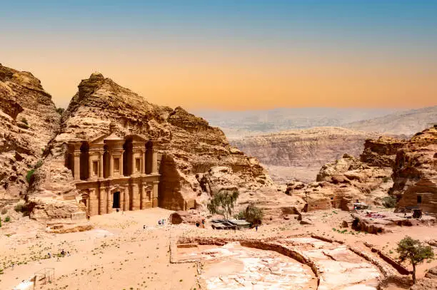 Photo of The Monastery or Ad Deir at beautiful sunset in Petra ruin and ancient city of Nabatean kingdom, Jordan, Arab, Asia