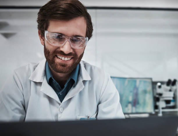 istock Man, technology or laboratory glasses safety for science research, medical analytics or bacteria vaccine study. Smile, happy or scientist in pharmacy innovation, future dna engineering or healthcare 1487401637