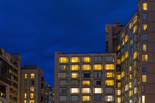 Modern apartment buildings during blue hour, Vancouver downtown, British Columbia, Canada.