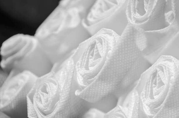rolls of white polypropylene fabric - close up shiny merchandise rough imagens e fotografias de stock