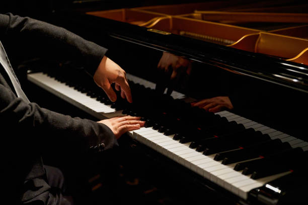 istock A pianist plays on the grand piano 1487404314