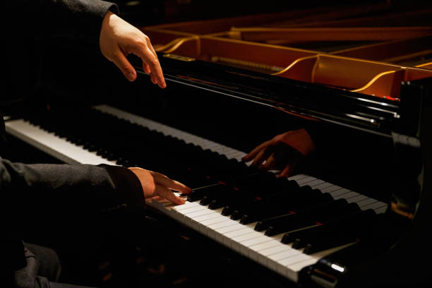 istock A pianist plays on the grand piano 1487404317