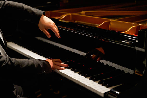 istock A pianist plays on the grand piano 1487404318