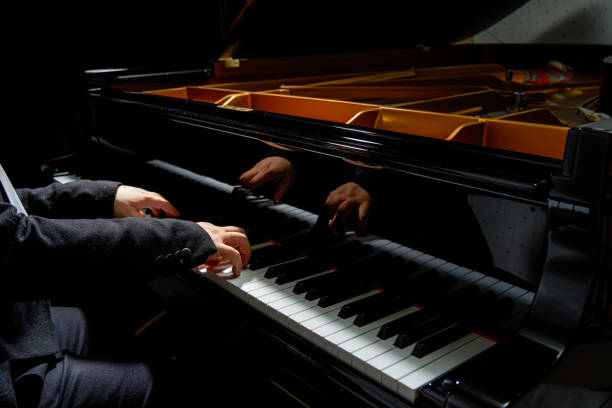 istock A pianist plays on the grand piano 1487404412
