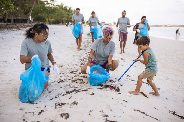 istock Little boy helping in cleaning the beach 1487404478