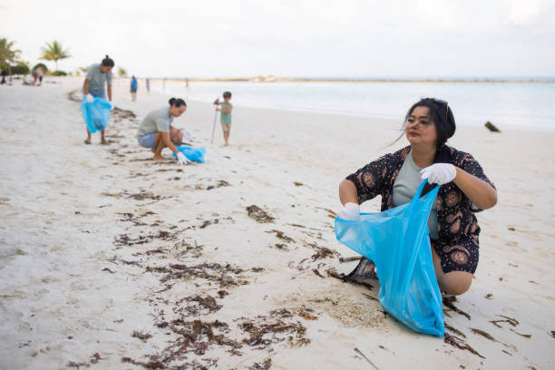 istock Activists cleaning garbage from the beach 1487406164