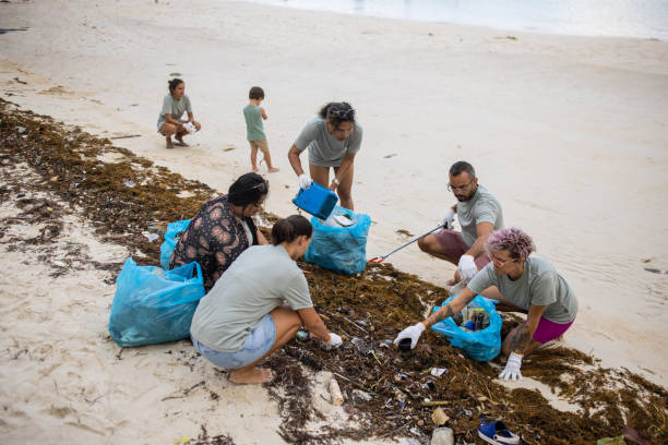 istock Activists cleaning garbage on the beach 1487407221