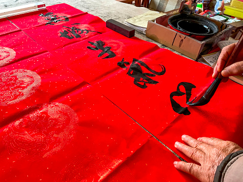 A calligrapher is creating and writing Spring Festival couplets, Chinese New Year Spring Festival